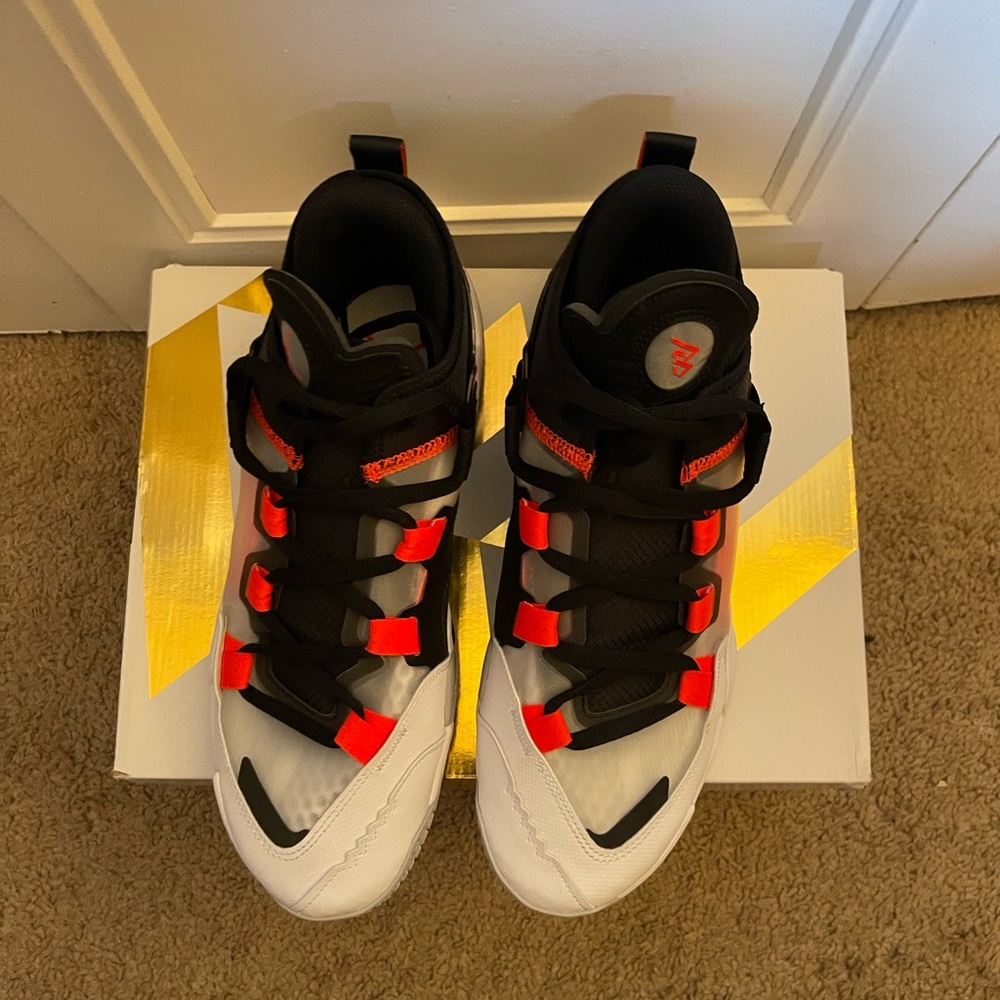Jordan why not .5 size 10.5 black and bold red